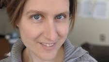 Close photo of a woman's face.