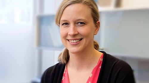 Portrait of a woman in three-quarters profile.