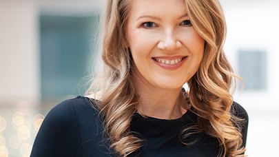 Close portrait of a woman with blonde hair.