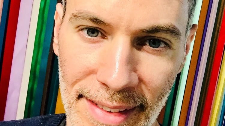 Close-up of a man's stubbly face.